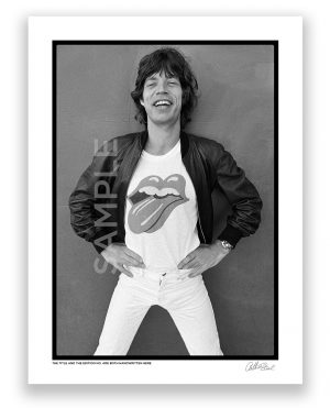 an exclusive black and white photograph of mick jagger of the rolling stones wearing the famous forty licks logo on his t-shirt by photojournalist arthur steel