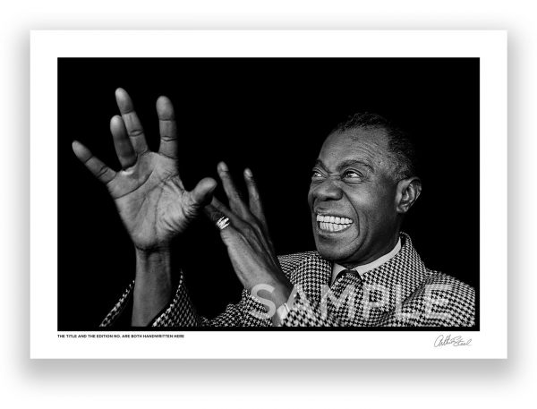 an exclusive black and white photograph of the famous american jazz musician louis armstrong air playing the trumpet by british photojournalist arthur steel