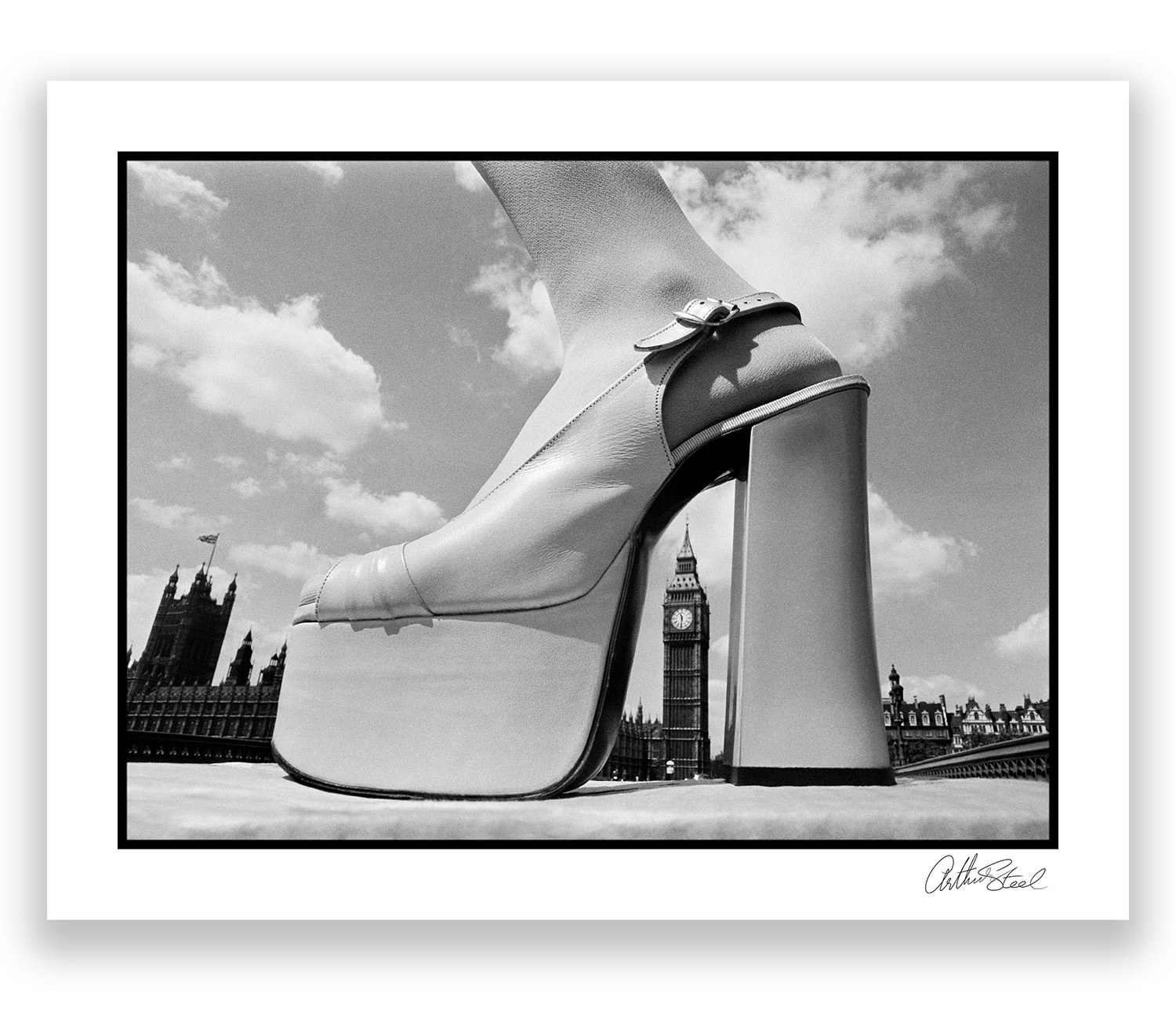 an exclusive black and white photograph of a platform shoe arching over big ben by arthur steel