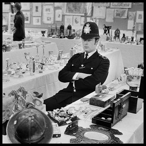 an exclusive limited edition photograph of a policeman at marylebone police station in london titled you're nicked by photographer arthur steel